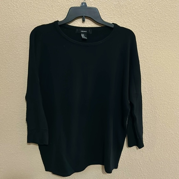 Gently worn sweater from Forever 21. This is a medium black on size and color - Picture 1 of 4